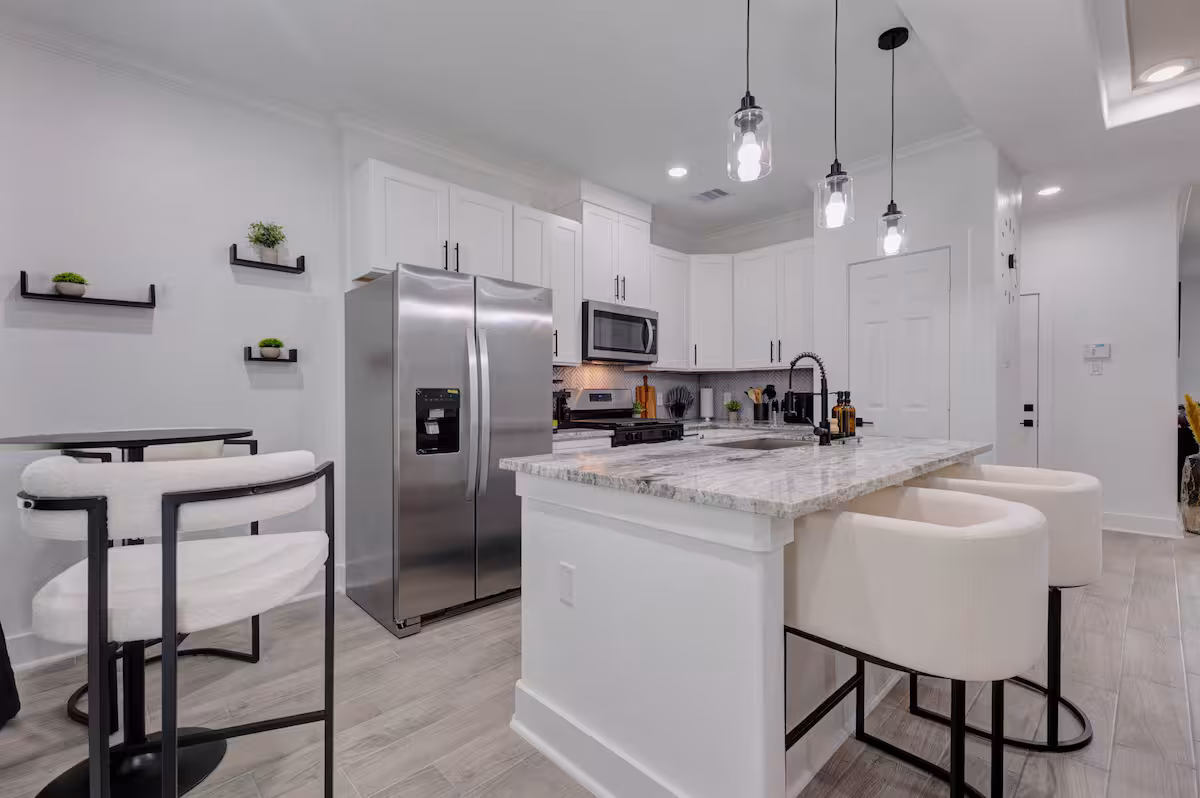Kitchen with breakfast bar seating where guest meals are prepared
